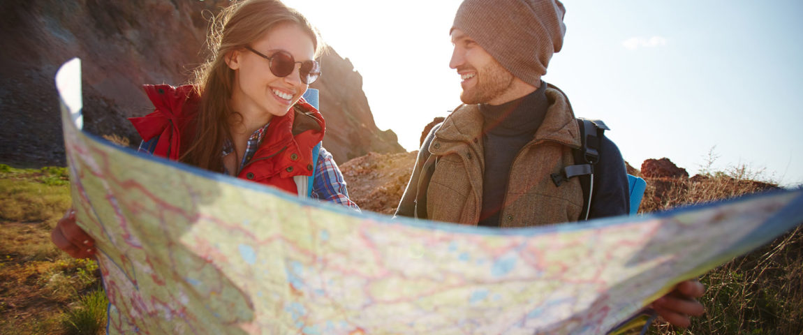 joyful-couple-hiking-mountains